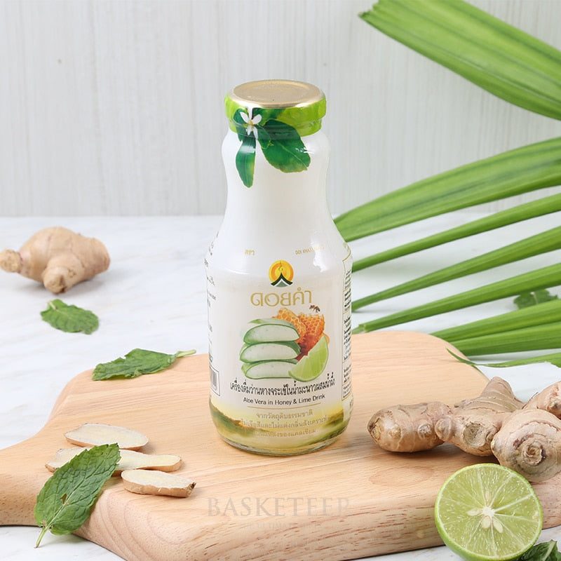 Premium aloe vera honey and lime wellness drink with fresh ginger and mint styling