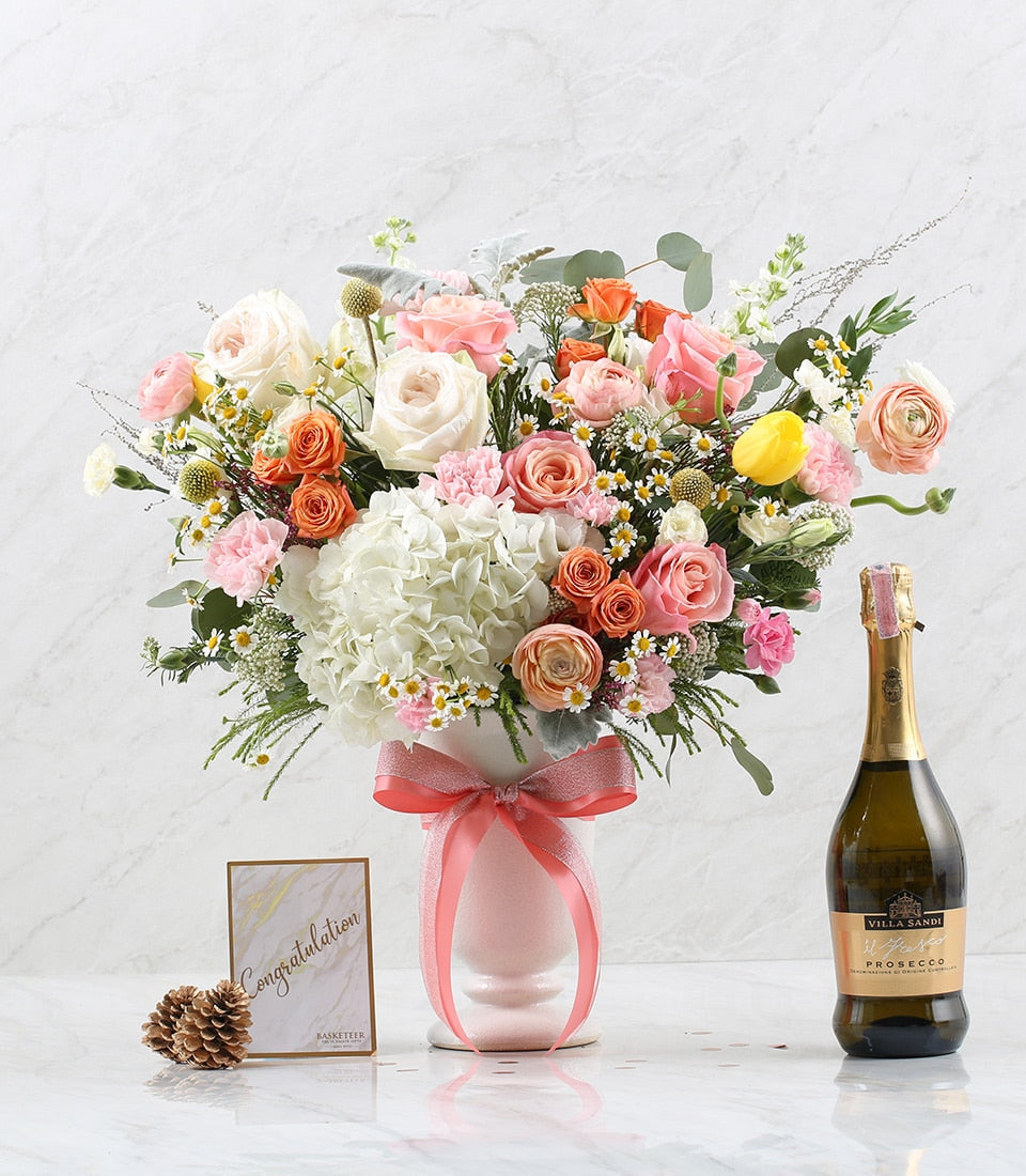 Floral Bloom & Prosecco Celebration Set with white roses, hydrangeas, and peach ranunculus, sparkling wine for anniversaries