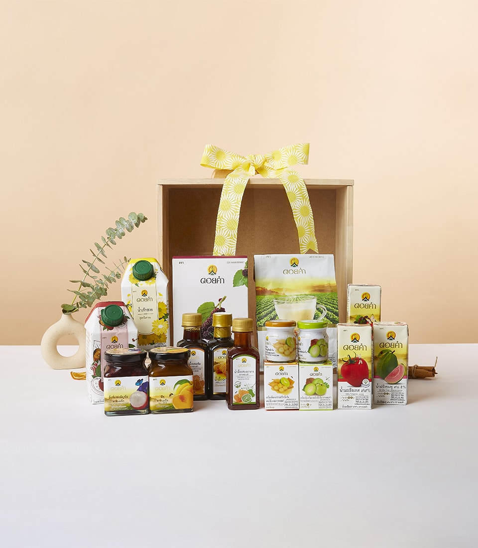 Doi Kham Treasures wooden crate gift box with artisan preserves, juices, and gourmet condiments tied with yellow ribbon