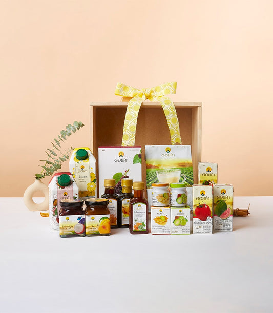 Doi Kham Treasures wooden crate gift box with artisan preserves, juices, and gourmet condiments tied with yellow ribbon