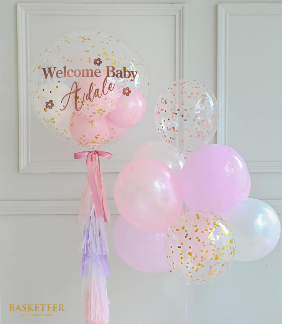 Sweet pink and white bubble balloon set with gold confetti and tassel garland for celebrations