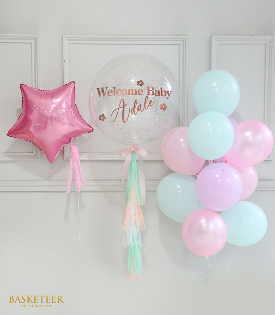 Pastel balloon gift set with pink star foil, personalized bubble balloon, and mint green latex balloons for baby celebrations