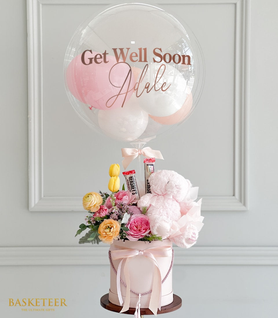 Soft pink balloon with fresh flowers, chocolates, and teddy bear get well soon gift set