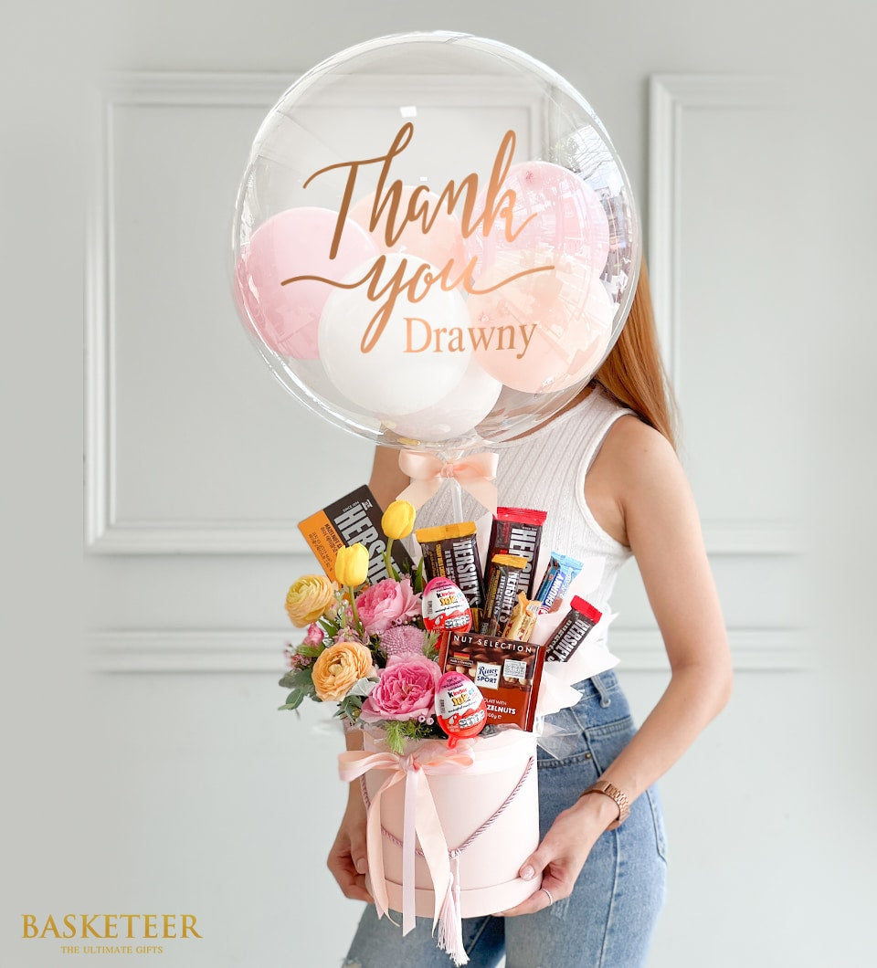 Pink balloon bouquet with fresh flowers, chocolates and Kinder Joy in luxury gift box