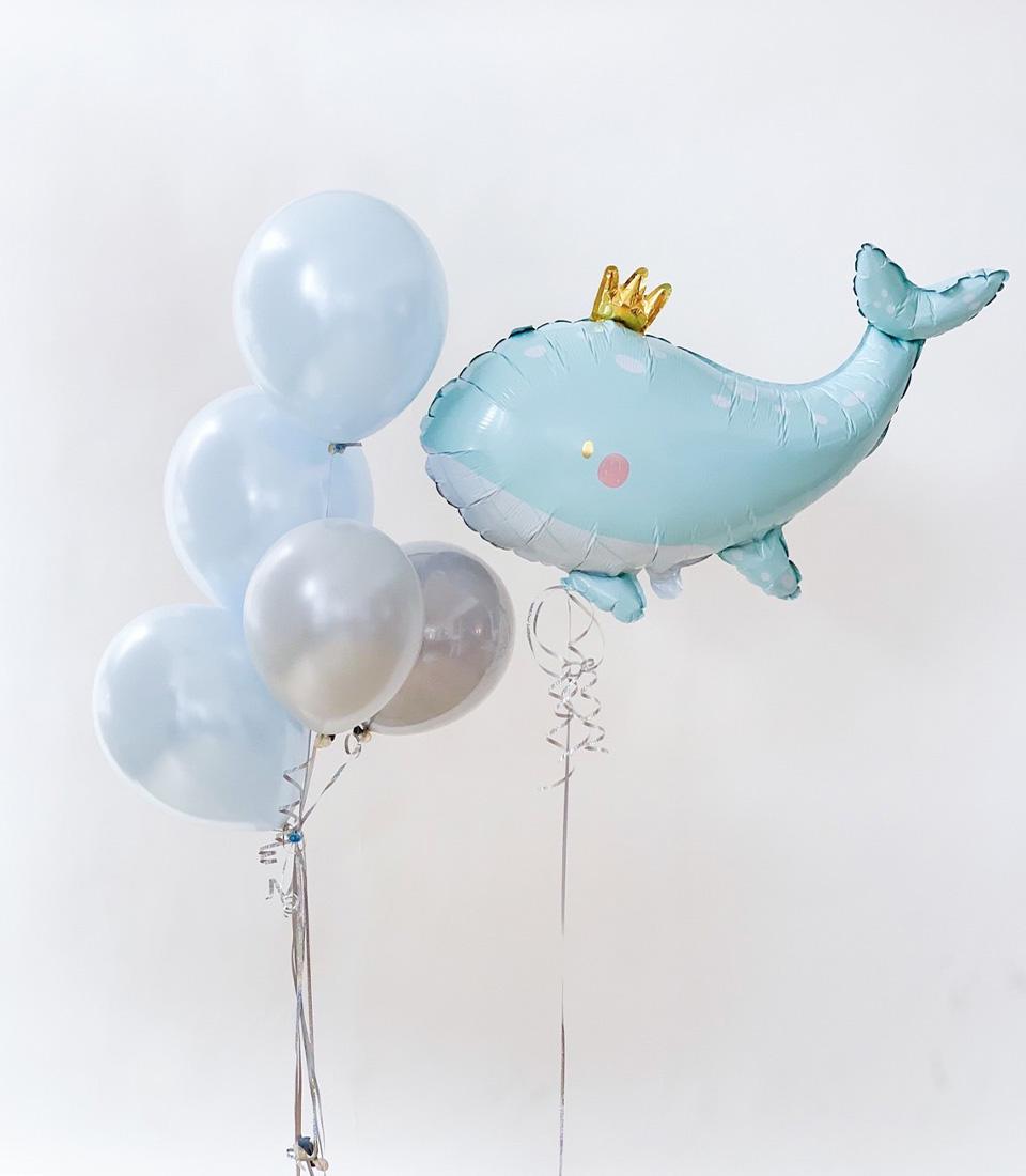 Light blue and silver latex balloons with adorable whale foil balloon for kids' birthday celebrations