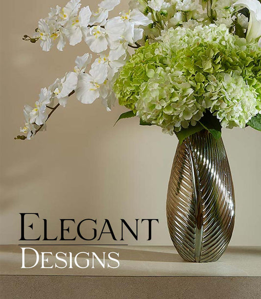 White orchids and soft green hydrangeas in bronze leaf-textured vase, elegant artificial flower arrangement