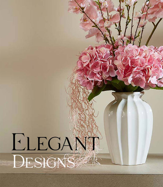 Pink hydrangea and cherry blossom artificial flower arrangement in white ceramic vase