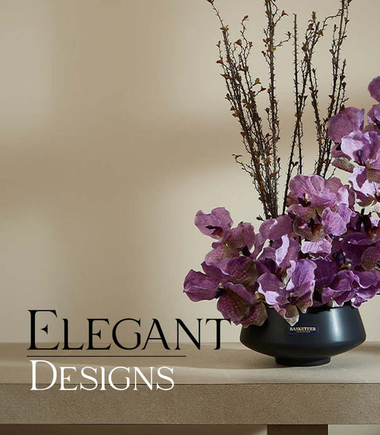 Purple orchid and branch arrangement in black ceramic vase, luxury artificial flower display