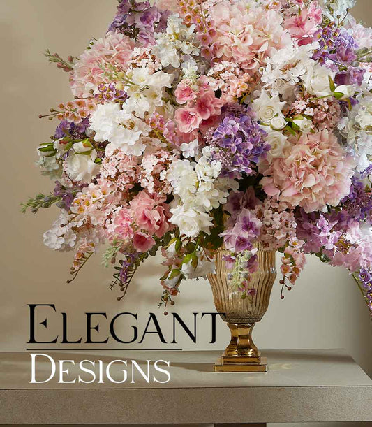 Luxurious large artificial flower arrangement with pink, white, and purple hydrangeas and roses in amber ribbed vase with