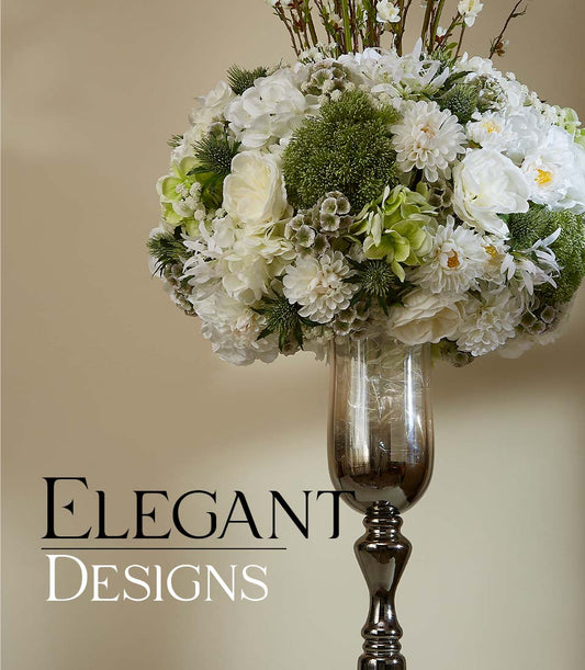 Tall white and green dahlia hydrangea rose arrangement in dark bronze metallic vase for luxury gifting