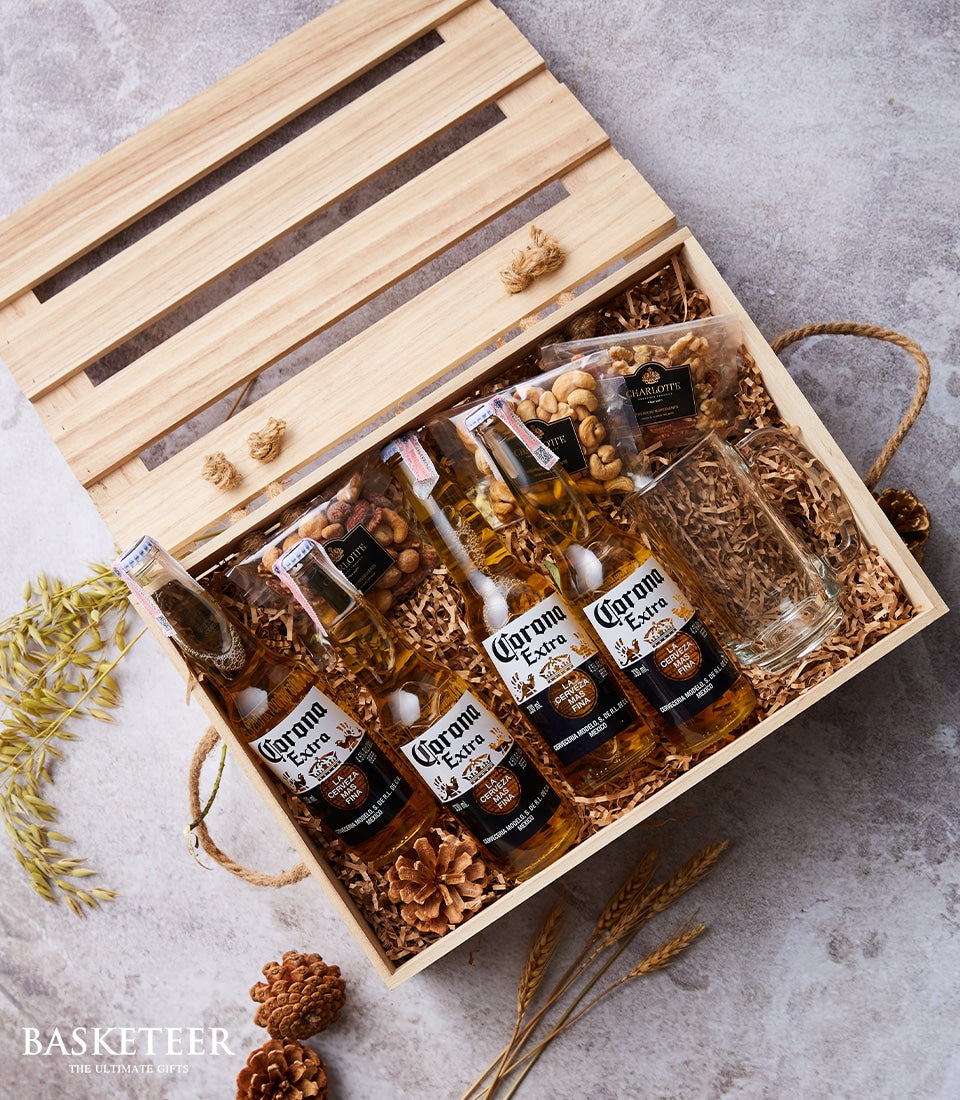 Corona Extra beer gift crate with glass mug, nuts, and rustic wooden packaging