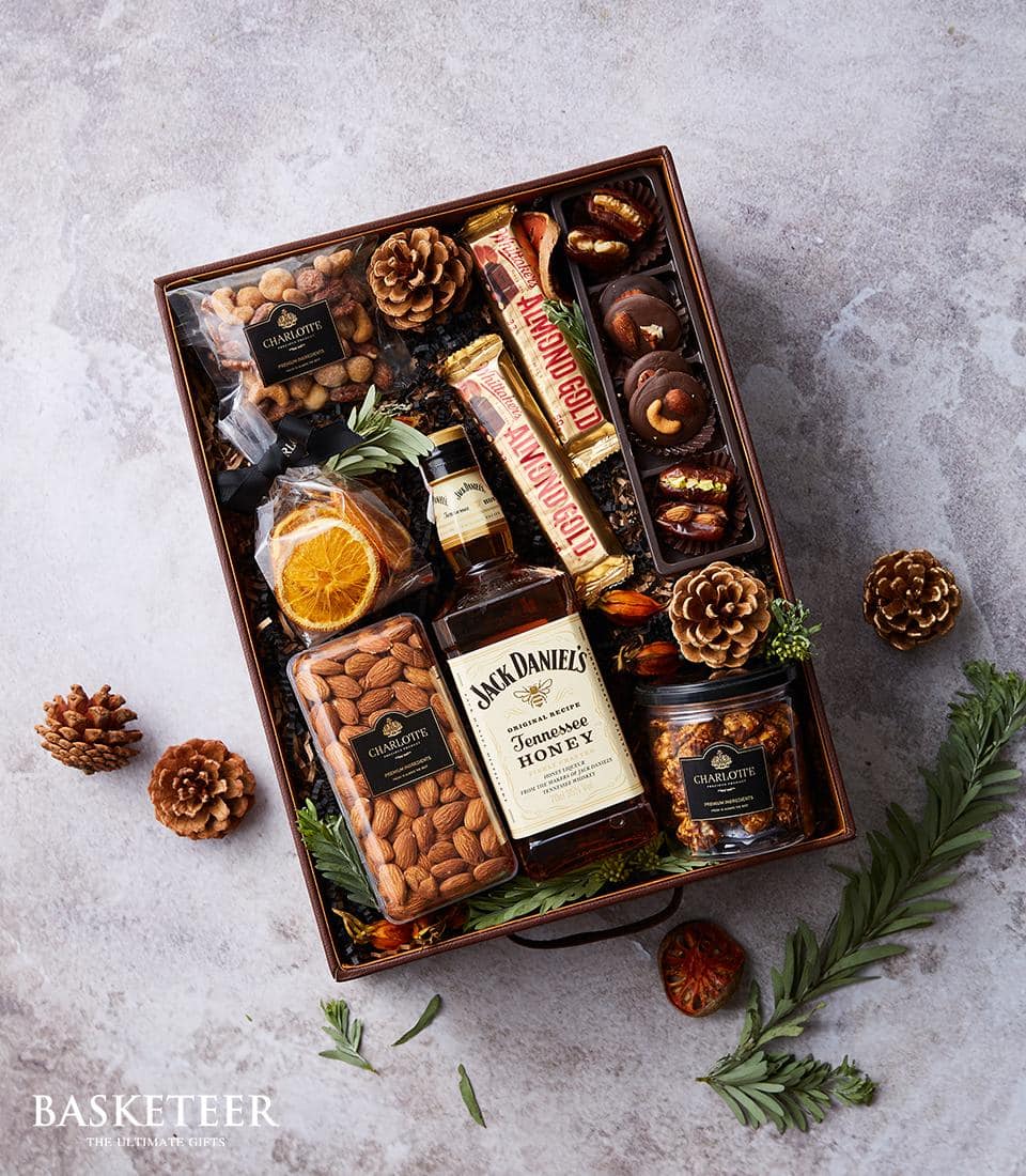Gentleman's whiskey and gourmet treats gift box with Jack Daniel's, chocolate bars, nuts, and candied almonds