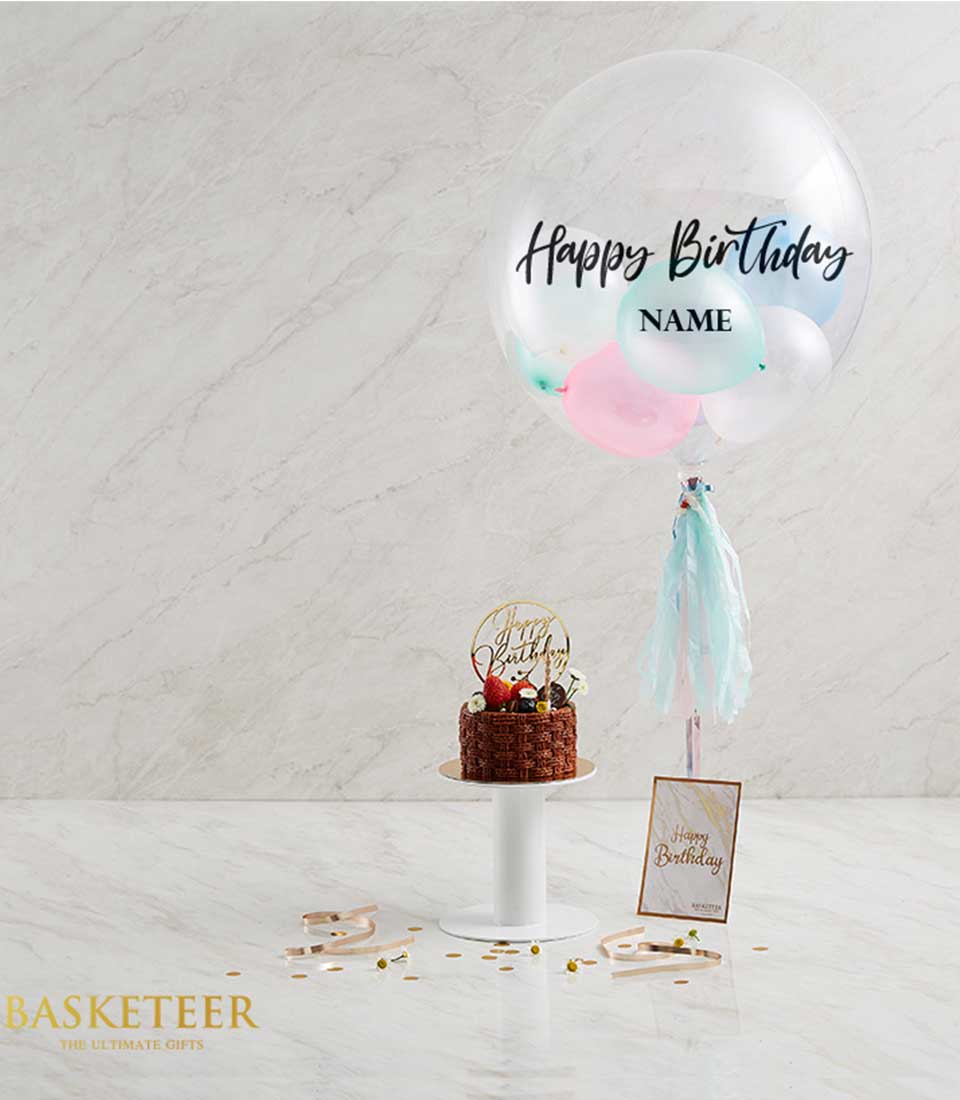 Birthday chocolate cake with fresh berries and pastel balloon gift set, gold cake topper and tassel garland