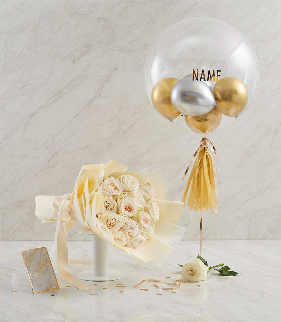 Cream-wrapped white and pink rose bouquet with gold and silver balloon combo, celebratory gift set