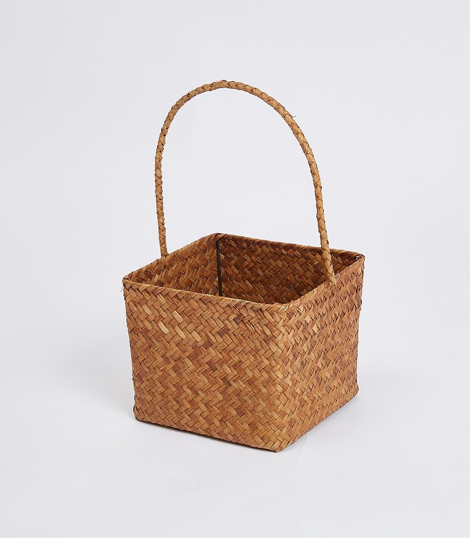 Natural woven straw basket with arched handle, herringbone weave design for premium gifting