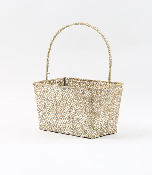 Natural woven straw basket with arched handle, empty and ready for gifting