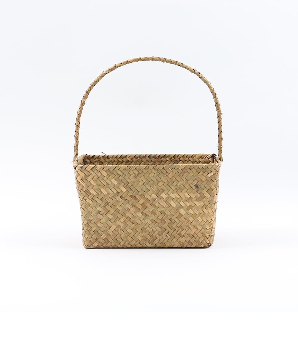 Natural woven seagrass basket with arched handle for luxury gift presentation