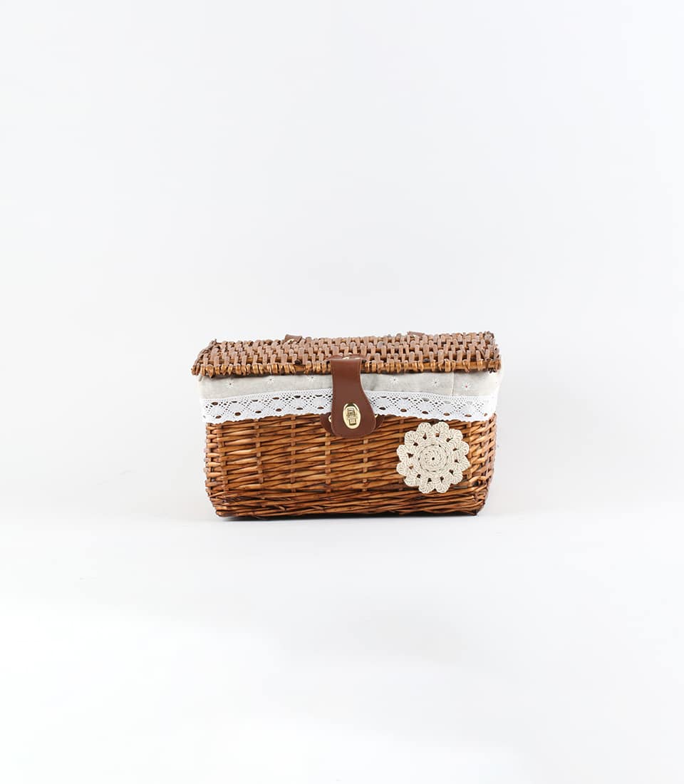 Woven wicker gift basket with brown faux leather strap and cream lace liner, ready for custom gifting