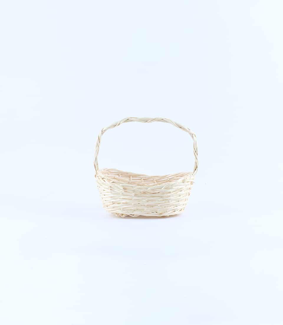 Light beige woven rattan basket with arched handle for luxury gift packaging