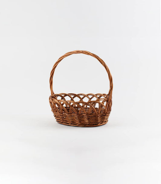 Dark brown wicker gift basket with curved handle, handcrafted willow weave