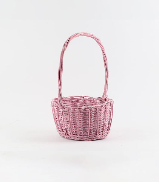Soft pink rattan basket with arched handle, empty woven wicker gift box