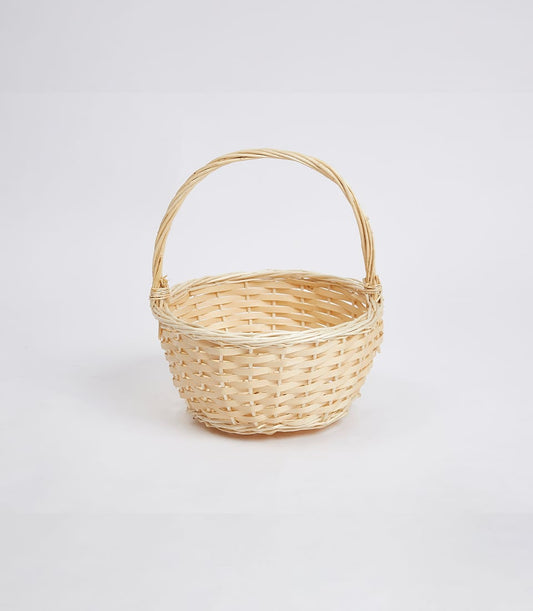Handcrafted light beige wicker basket with arched handle for premium gift presentation