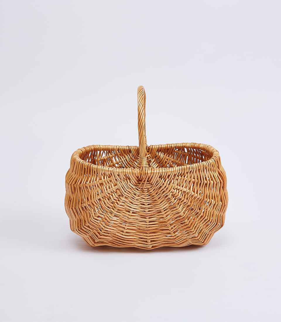 Light brown wicker basket with integrated handle, handcrafted for premium gifting