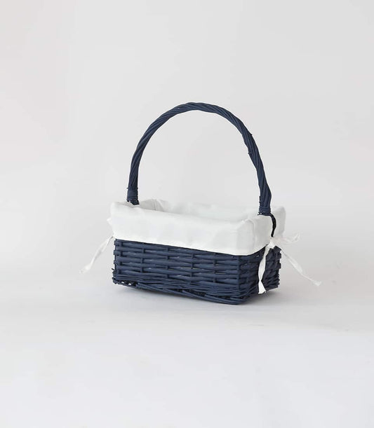 Navy rattan gift basket with white fabric liner and twisted handle