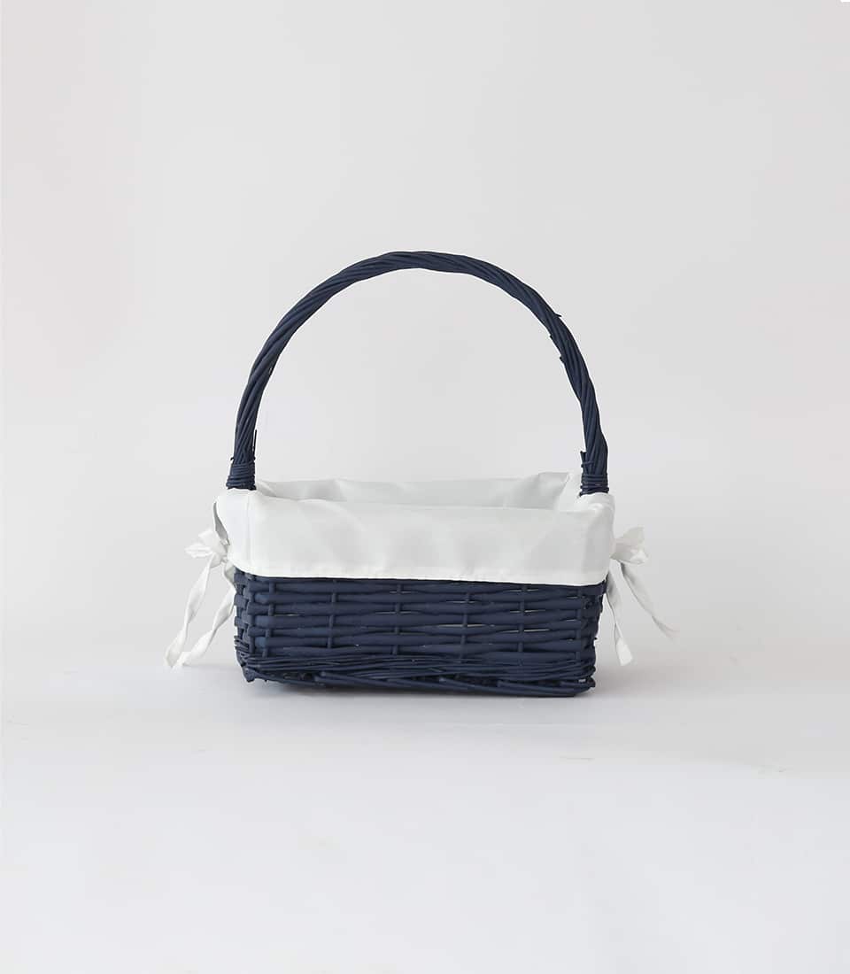 Navy wicker gift basket with white fabric liner and twisted handle