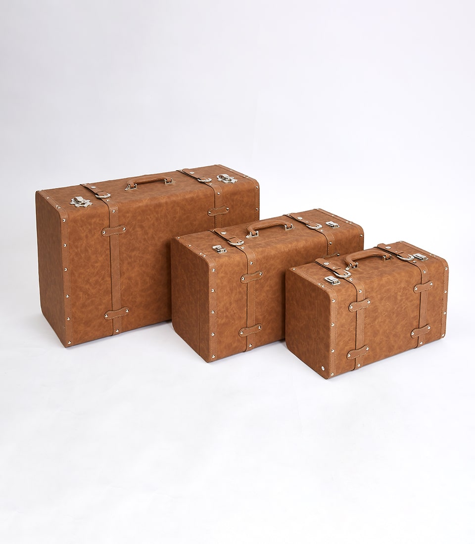 Vintage brown leather suitcase set of three with metal hardware and handles, classic gift hamper storage