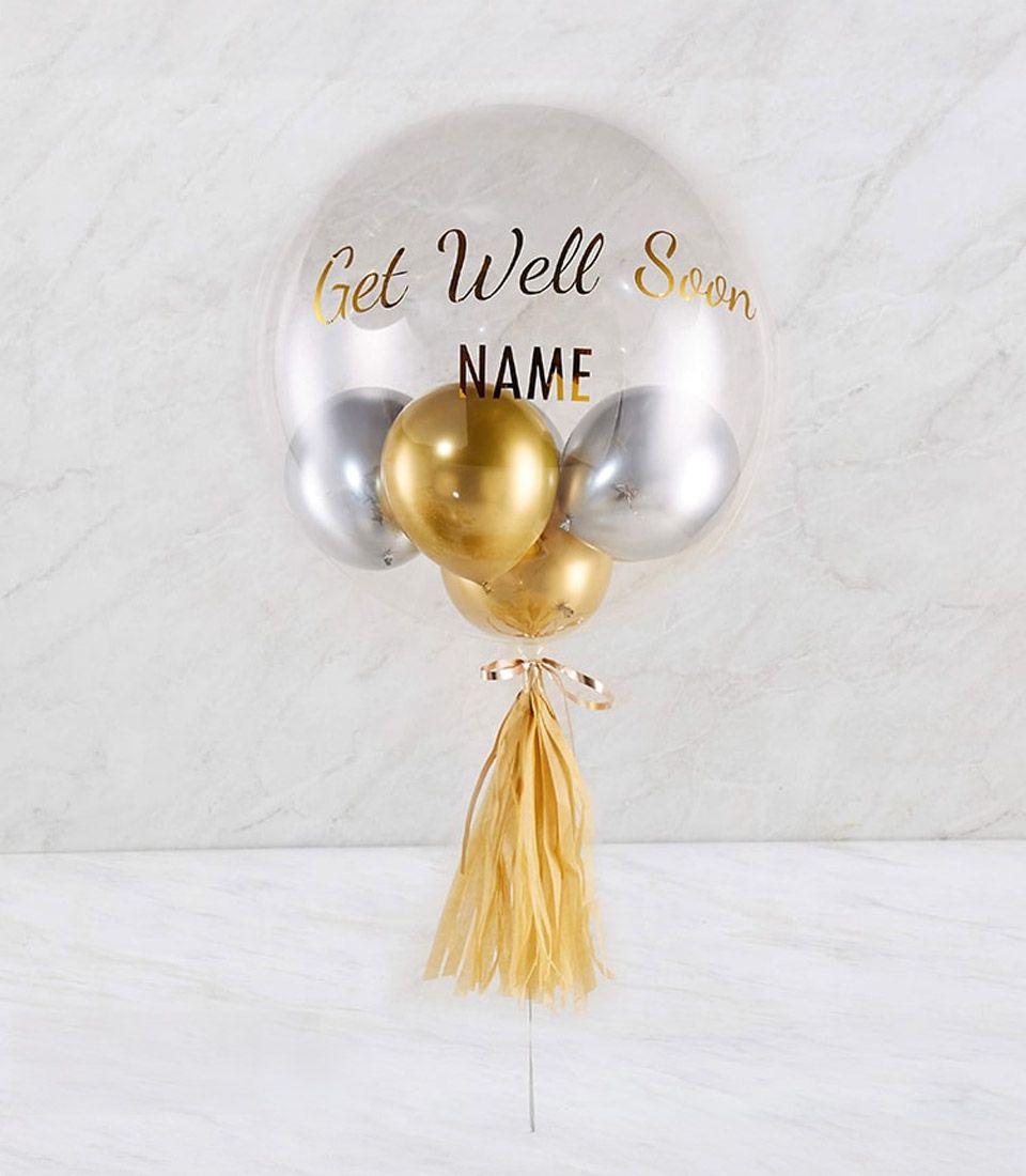 Personalised Get Well Soon bubble balloon with gold script, metallic gold and silver balloons, and gold tassel cluster
