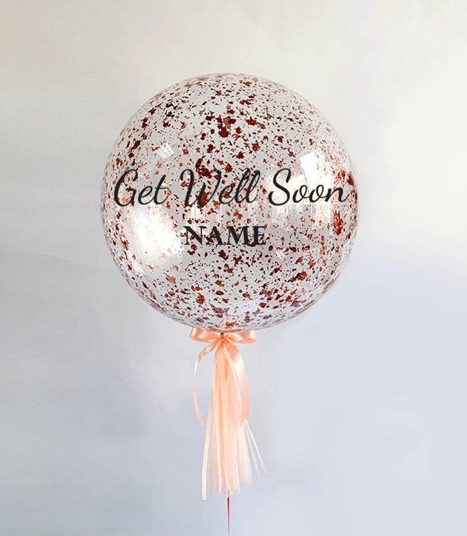 Rose gold confetti balloon with Get Well Soon personalised message and peach satin ribbon tassel