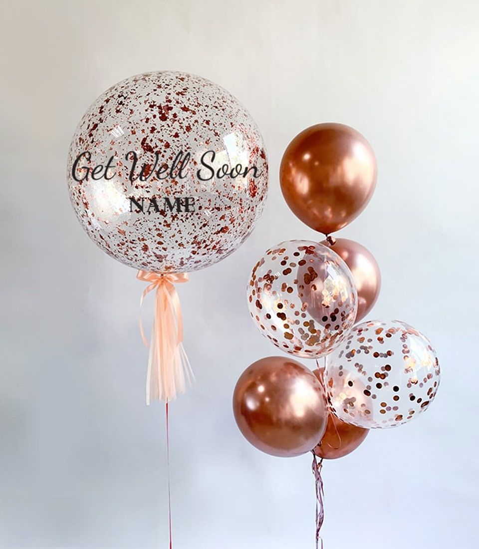 Personalised Get Well Soon balloon bouquet with rose gold confetti and peach ribbon streamers