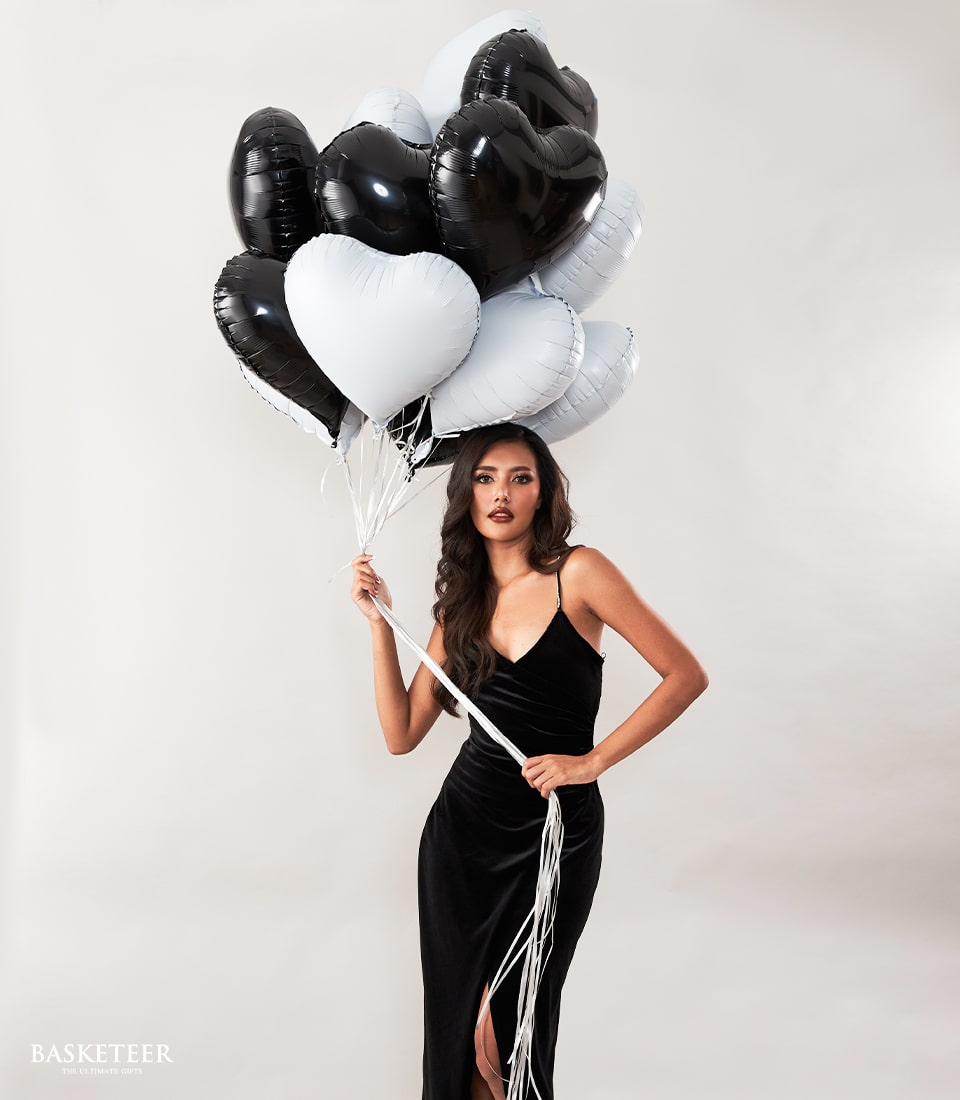 Black and white heart-shaped foil balloons bouquet with white ribbons, elegant gift set for couples and celebrations