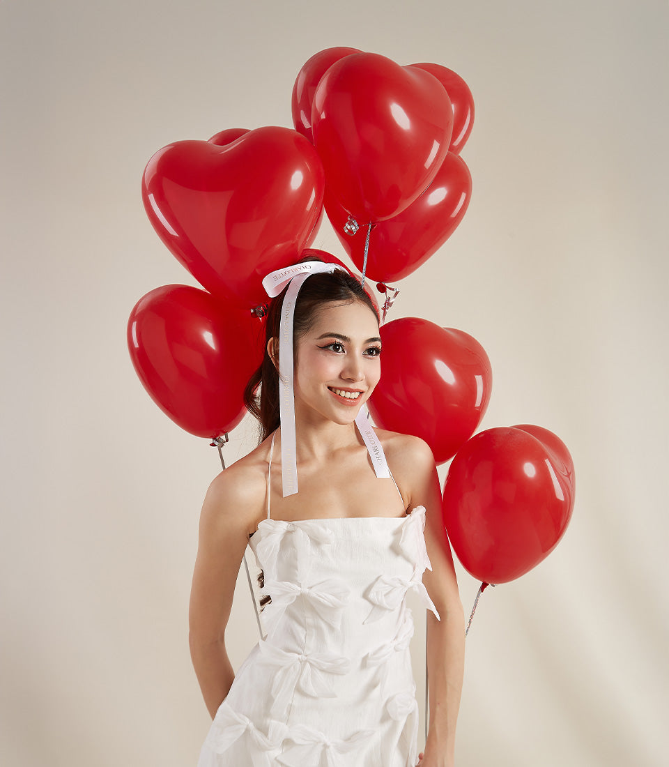 Red heart-shaped balloon gift box surprise for Valentine's Day