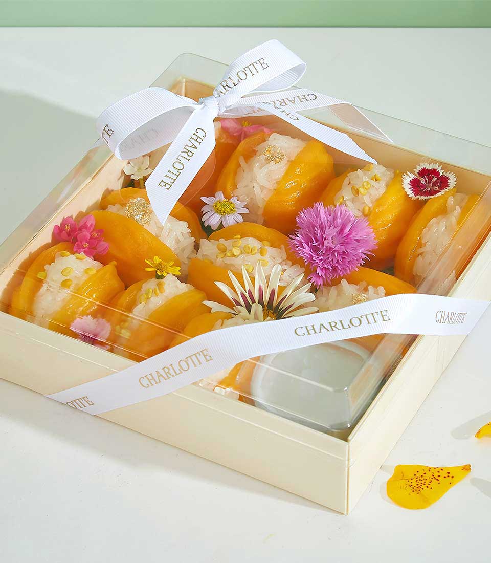Mango sticky rice dessert gift set with fresh fruit and edible flowers in cream gift box