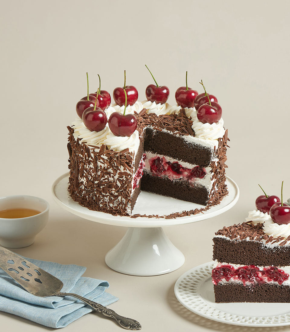 Charlotte Bakery's artisan round chocolate cake with whipped cream, luscious cherry filling,