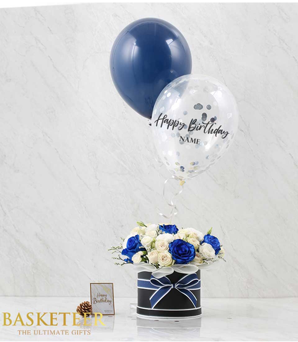 Blue and white roses with navy balloons in black gift box, birthday flower arrangement