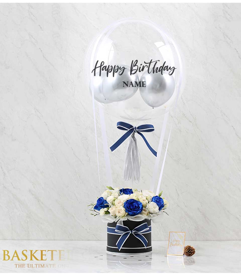 White and blue roses in striped box with Happy Birthday balloon arrangement, luxury birthday gift