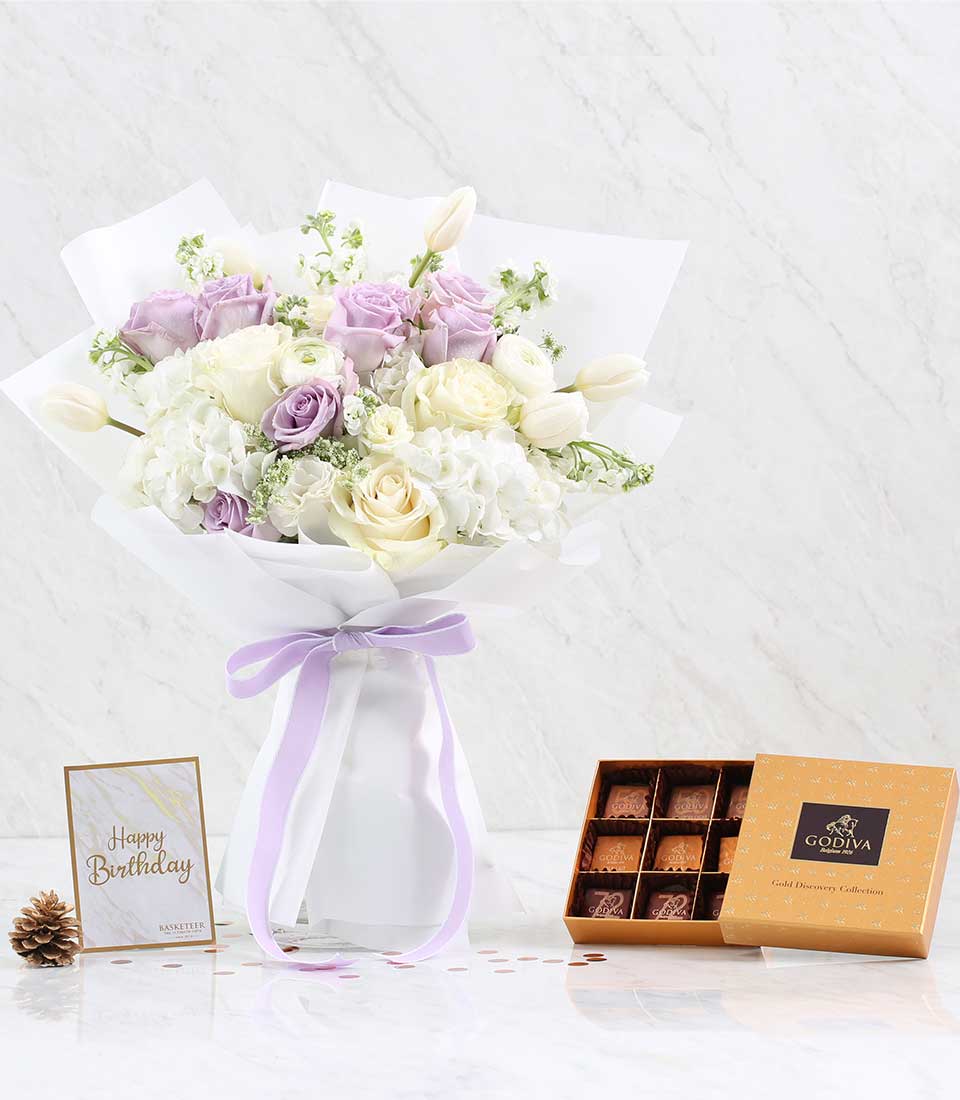 Pastel rose and hydrangea bouquet with Godiva chocolates, birthday gift set with white marble styling