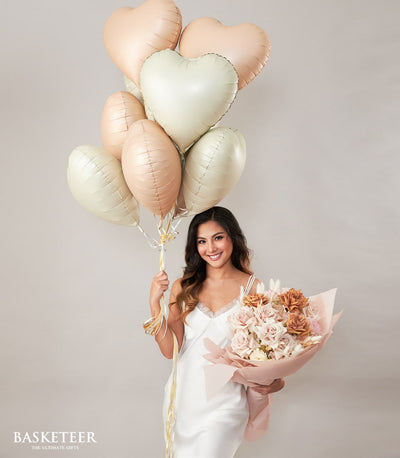 Blush pink roses and heart-shaped balloons bouquet gift for birthday celebration