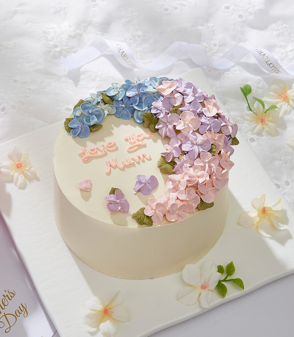 Light blue hydrangea buttercream cake with Love You Mum message, Charlotte Bakery Mother's Day celebration cake