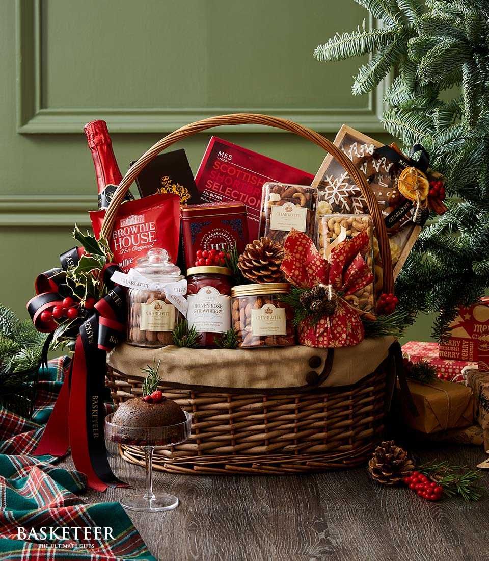 Festive Christmas hamper with red wine, gourmet snacks, Scottish shortbread, and holiday berries in wicker basket