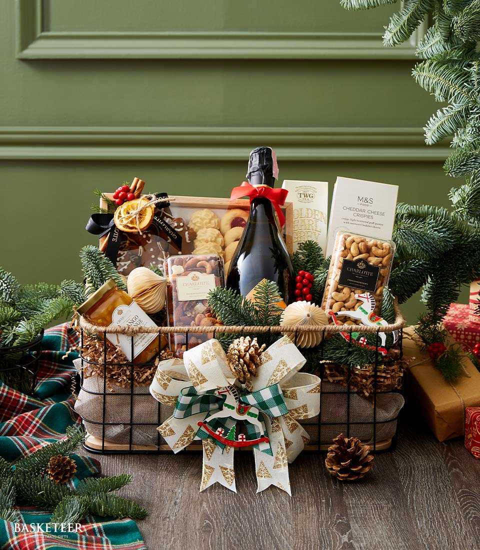 Holiday Elegance Prosecco basket with sparkling wine, gourmet treats, nuts, and festive pine décor