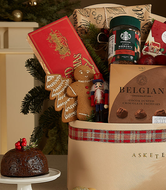 Cream leather festive hamper with red plaid ribbon, gourmet treats, gingerbread cookies, Belgian truffles and Christmas