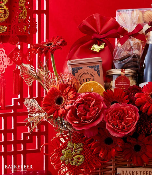 Red luxury Chinese New Year gift basket with premium wine, fine teas, butter cookies, and festive roses