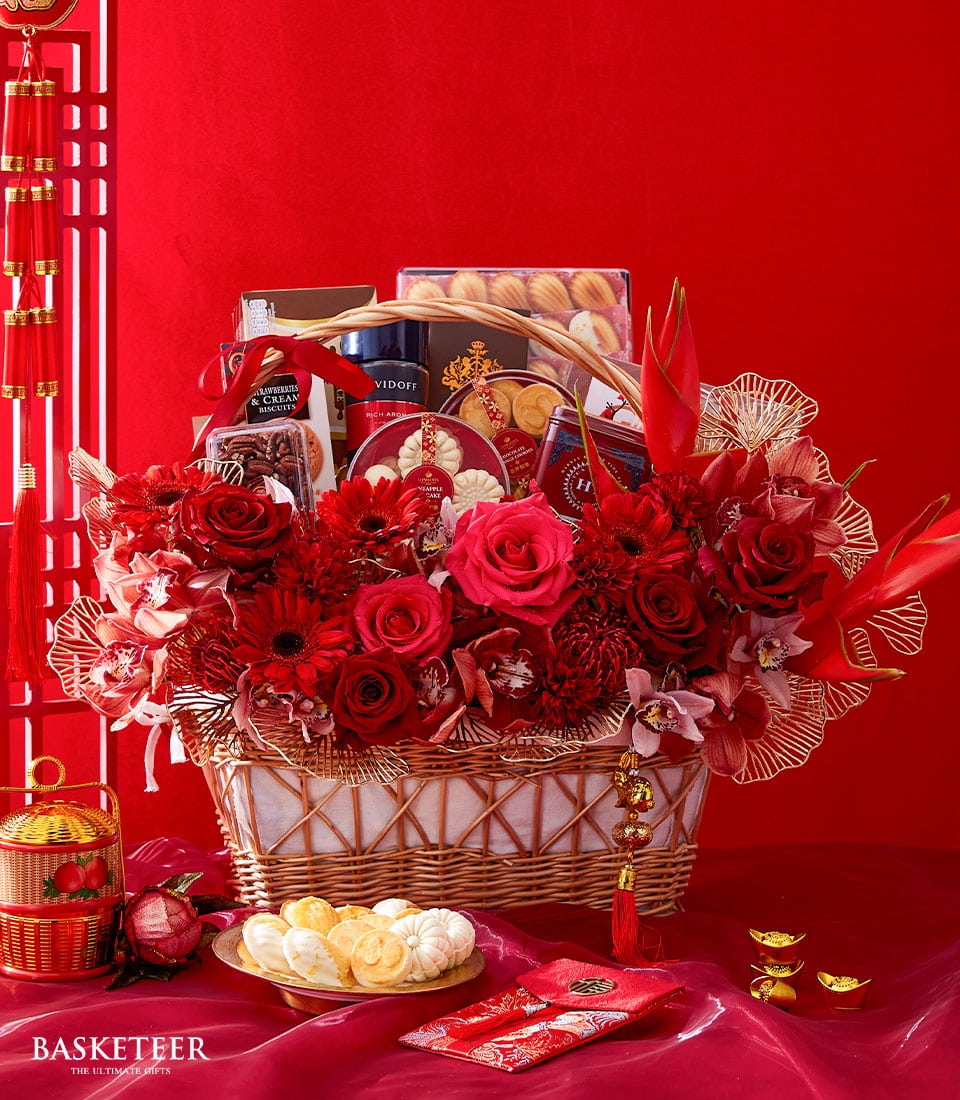 Grand Chinese New Year luxury gift hamper with red roses, gourmet sweets, and gold accents in woven wicker basket
