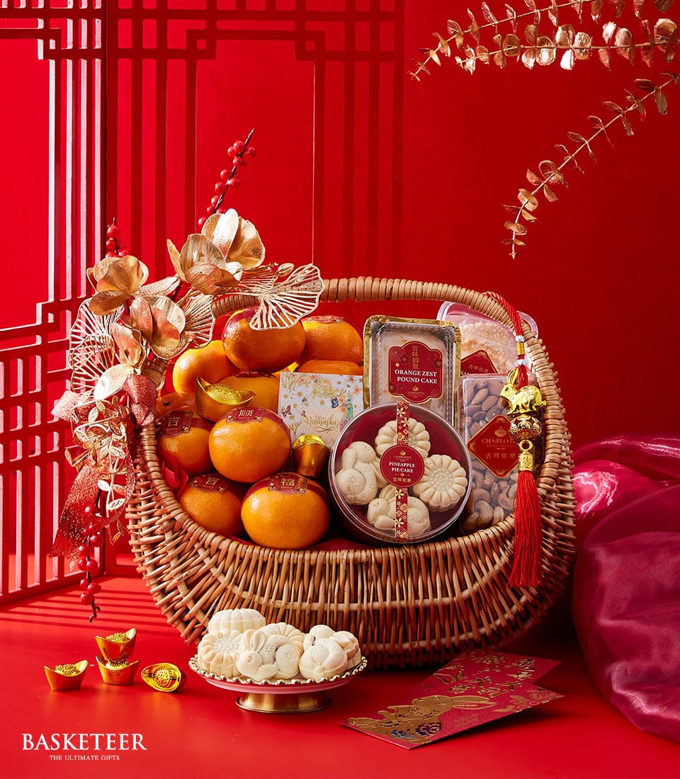 Basketeer luxury gift basket Bangkok: Wicker hamper with persimmons, festive cookies, and pound cake. A premium hamper delivery in Thailand.