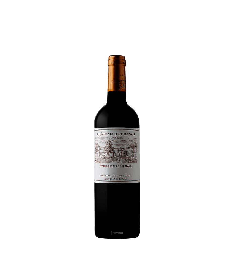 Royal Merlot Prestige Château de Francs red wine bottle with copper foil capsule against white background