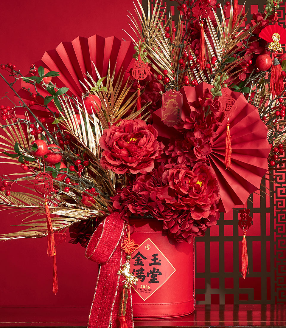 Basketeer premium hamper delivery Thailand: red & gold floral arrangement in gift box with decorative fans & tassels. Perfect corporate gift Bangkok for Chinese New Year.